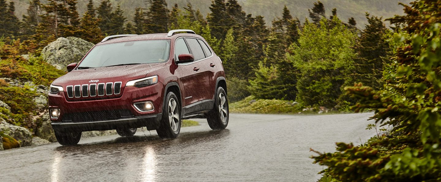 The 2020 Jeep Cherokee Limited being driven in heavy rain.