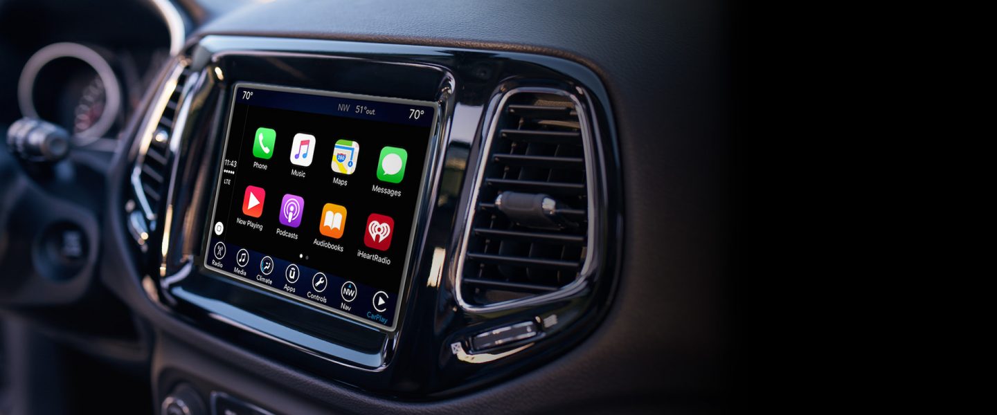 A close-up of the touchscreen in the 2020 Jeep Compass displaying menu selections.