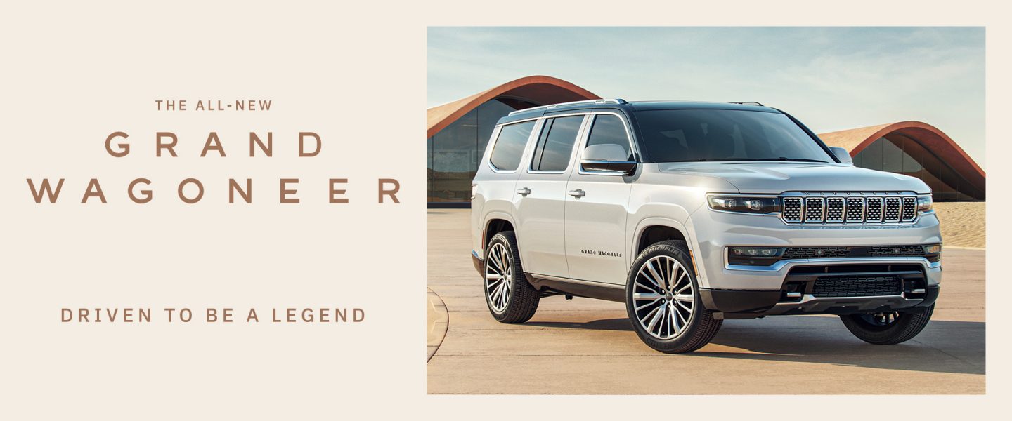 The 2023 Grand Wagoneer Series III parked off-road in a misty field.