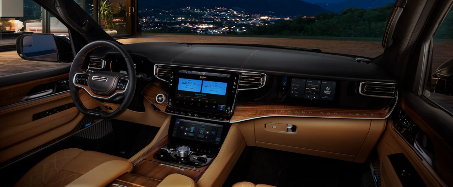 A close-up of the Uconnect touchscreen and passenger screen in the 2023 Grand Wagoneer Series III.